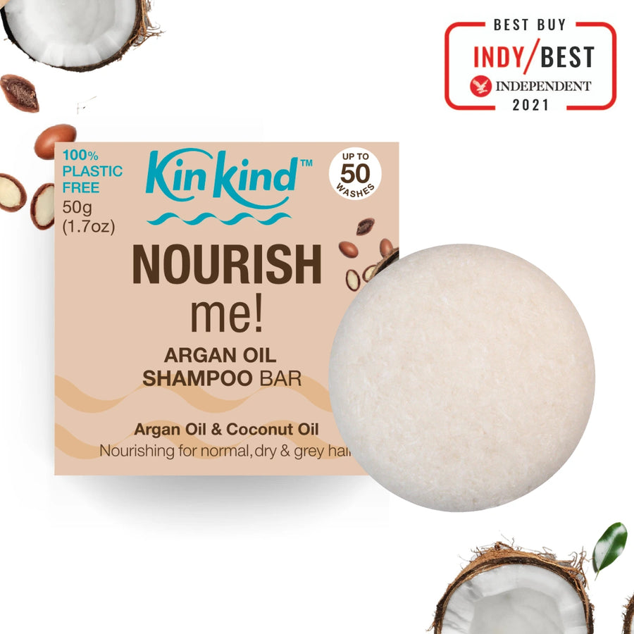 Kind KInd Nourish me! Argan Oil & Coconut Oil Shampoo Bar with packaging and coconut elements on a white background.