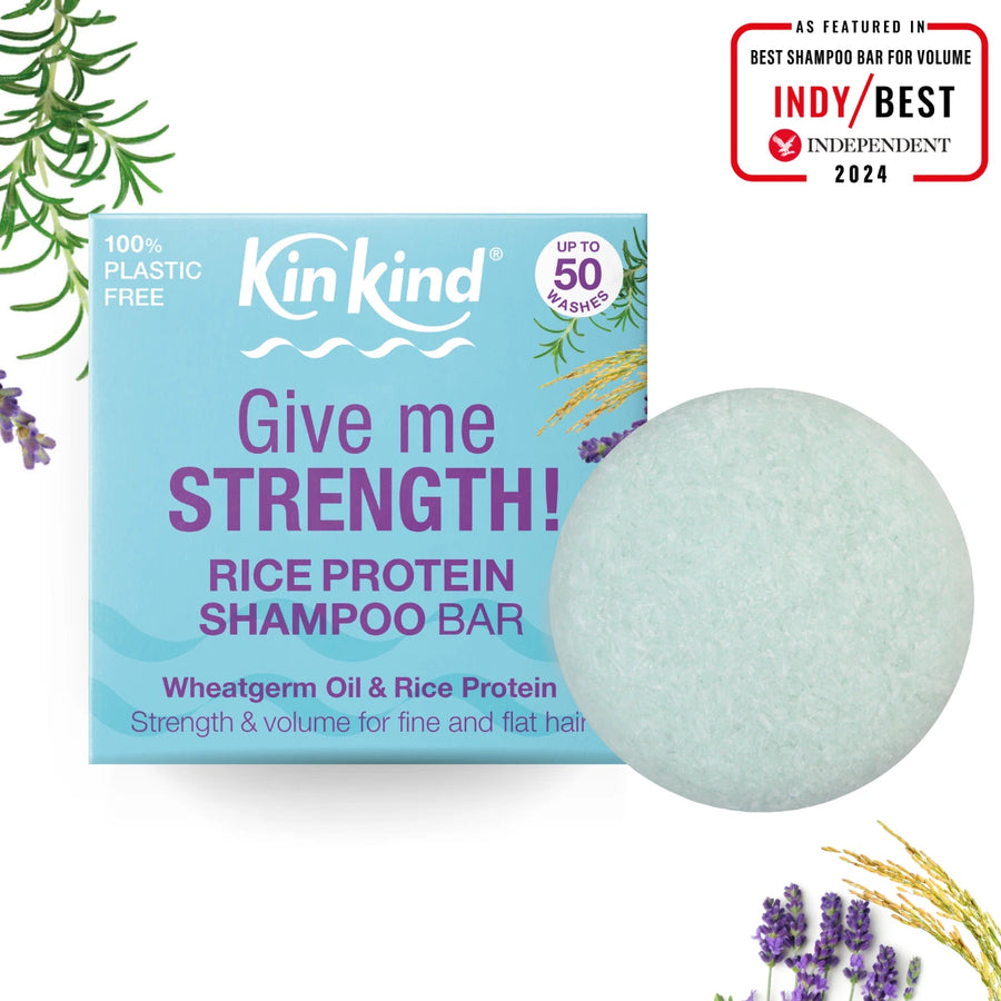 Kin Kind rice water shampoo bar with packaging on a white background & award.