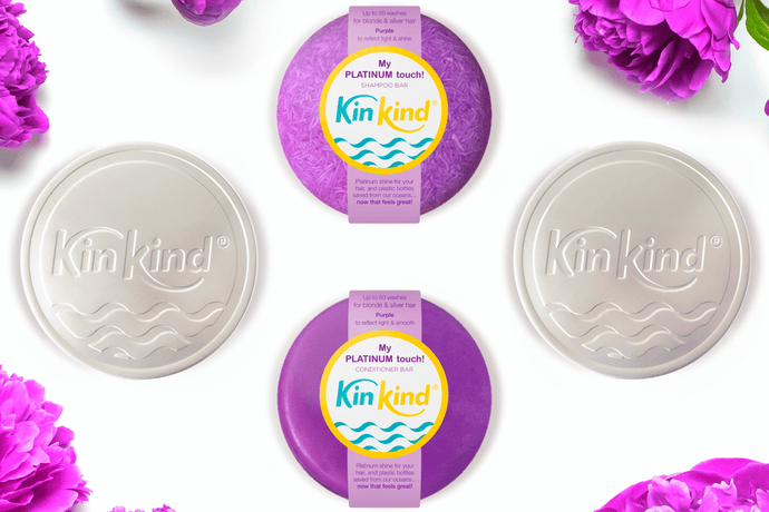 purple shampoo and conditioner bars with travel tins